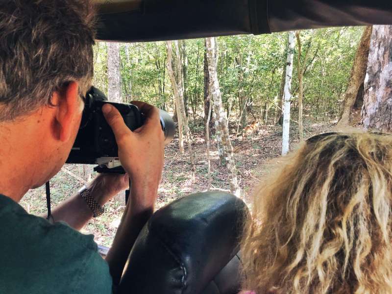 A Wilpattu safari guest is taking a picture