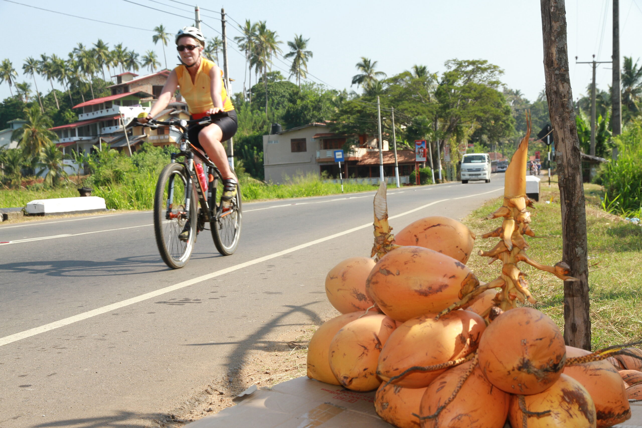 A lady experiencing their cycling tour at Kalthota in Sri Lanka